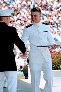 Graduating from the Naval Academy.